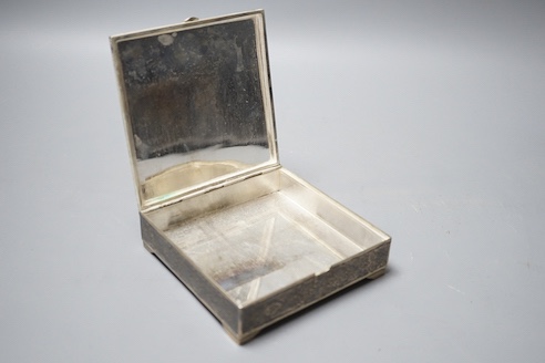 A Persian engraved white metal and niello cigarette box, stamped 84, 11.9cm, gross 12.5oz.